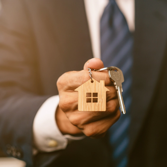 appraiser holding a key with a house keychain 1 visalia ca